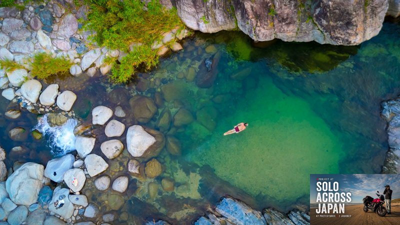 Clear emerald river pool in Saga Prefecture discovered during a solo motorcycle travel journey across Japan