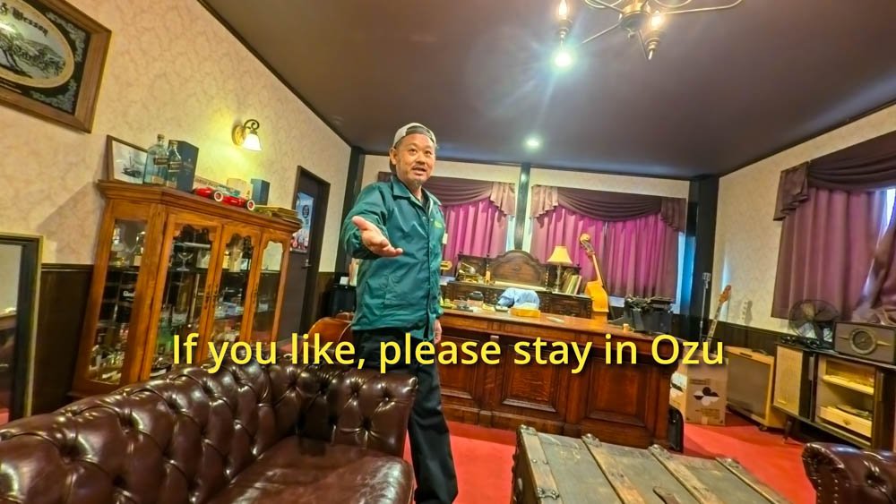Inoue-san speaking inside a vintage-style room in Ozu, Ehime