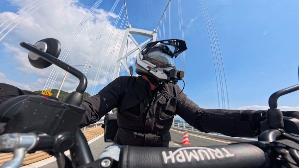 Motorcycle rider crossing a bridge through Hiroshima Prefecture Shimanami Kaido