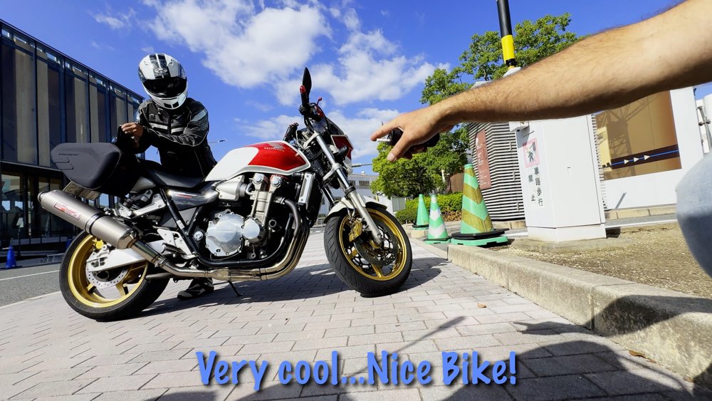 Honda motorcycle and rider during a roadside meeting in Hiroshima Prefecture