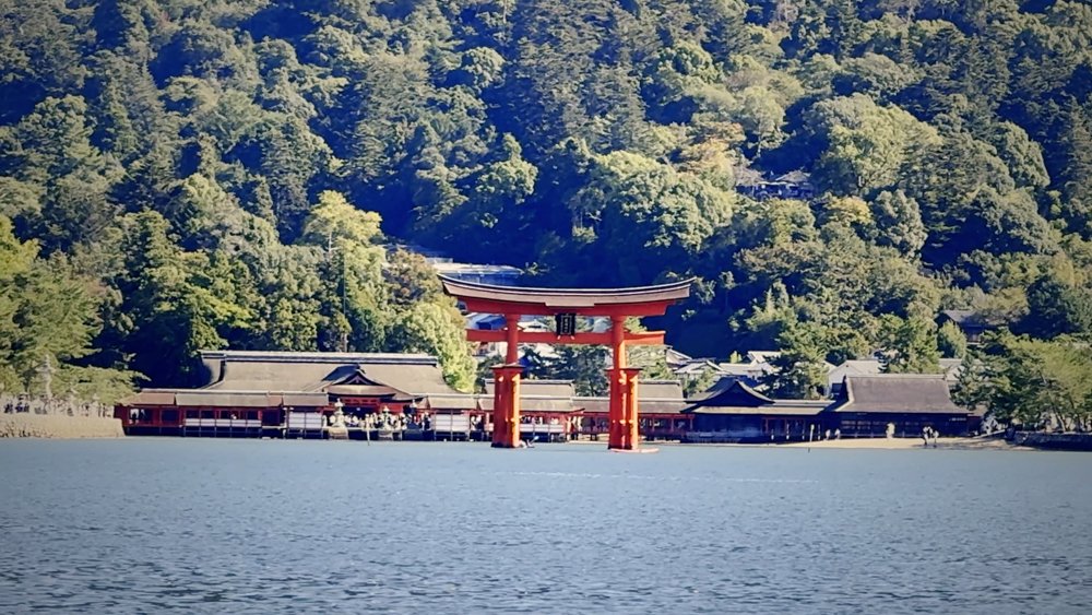 Great torii gate of Itsukushima Shrine seen across the water at Miyajima