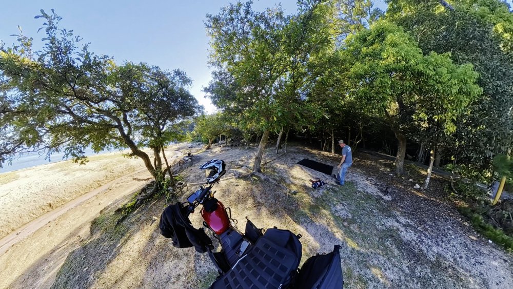 Setting up a motorcycle camp beside the coast on Miyajima Hiroshima Prefecture