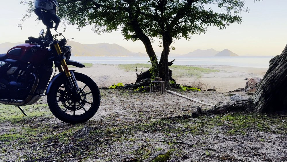 Setting up a motorcycle camp beside the coast on Miyajima Hiroshima Prefecture