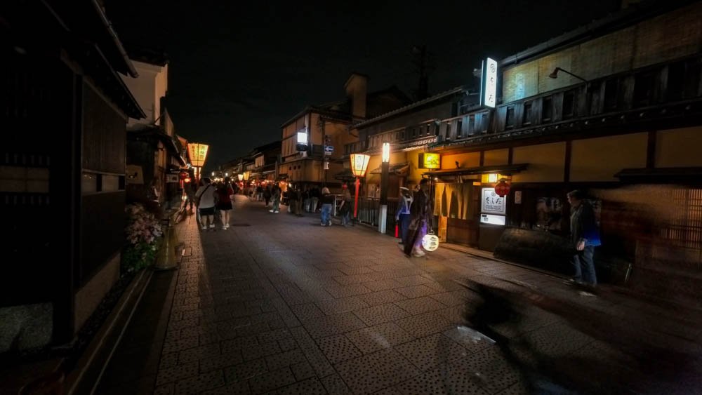 Traditional wooden buildings and lantern-lit street in Gion, Kyoto at night