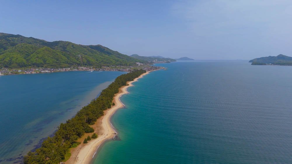 Aerial view of Amanohashidate, the pine-covered sandbar stretching across Miyazu Bay in Kyoto, Japan