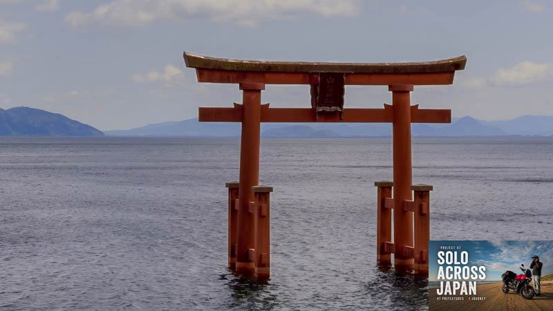 Red torii gate of Shirahige Shrine standing in Lake Biwa, Shiga, Japan